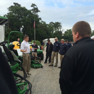 Mark Ford, marketing manager, John Deere Golf, answers questions from the crew and volunteers about the new A Models from John Deere.