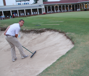 BASF's Thompson rakes a bunker on No. 18 on Monday of the U.S. Open. "I feel like a kid in a candy shop," he says. Photo by: Seth Jones