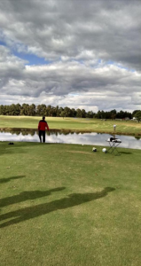 If you look for it, you can see the white soccer ball in the air above the pond. It made it over! 