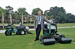 Jim Coker of R&R Products stands with propane-powered mowers about to be shipped to Stone Mountain (Ga.) GC. 