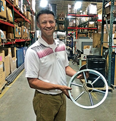 Scott Melling of Par Aide displays the blade designed to cut the 15-inch cup.