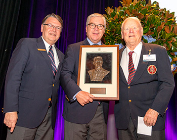 Thomas J. O'Toole Jr., USGA President, center, along with Mark P. Reinemann, a member of the USGA Executive Committee, left, as they present Dr. David Cookson with the Joe Dey award during the USGA Service Awards Dinner at the 2015 USGA Annual Meeting at Waldorf Astoria in New York, N.Y. on Feb. 7. (Copyright USGA/Chris Keane)