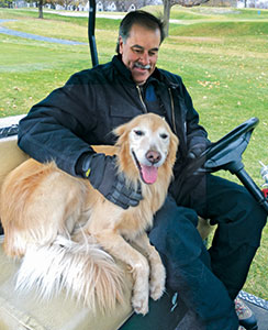 Larson and Piper, his Golden Retriever.