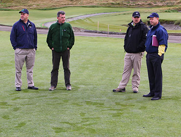 Darin Bevard, Eric Johnson, Josh Lewis and Mike Davis discuss course set-up during a walk-through in mid-March.