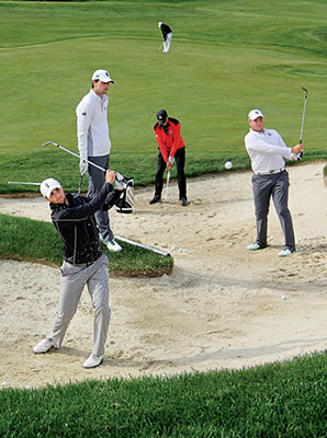 Golfers competing in the 2015 Big Ten Men's Golf Championship warm up on the morning of the first round at the practice range of Victoria National.