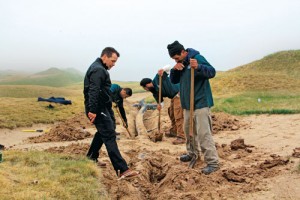 Chris Zugel oversees a crew working on bunker drainage in May. Many of the bunkers washed out in 2010 after almost 2 inches of rain fell on the course the day before the tournament started. “We want them to take an inch or 2 of rain without needing to be pumped,” Senior Assistant Superintendent Joe Sell says.