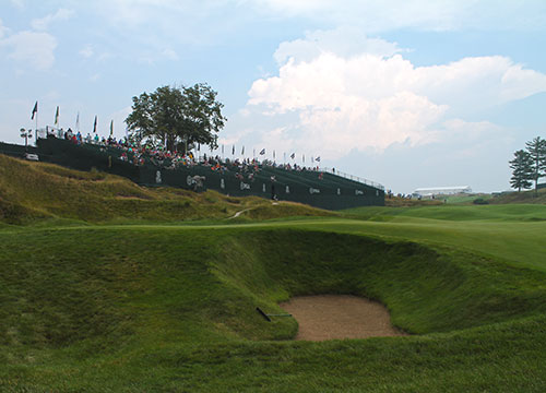 Grandstand facing the 18th and final hole of the PGA Championship with one of the signature bunkers situated next to the green of course.