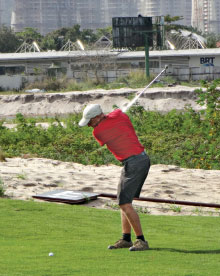 Neil Cleverly hits the first shot on the course — on No. 17.