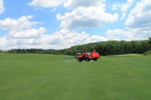 A Smithco sprayer fitted with a Turflux RTK GPS receiver makes an application of BASF's Xzemplar fungicide on June 28.