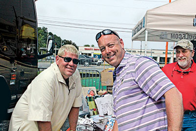 Rich Sweeney of the Plant Food Co. (right) talks to John Daly about career opportunities on the turf side of the business. 