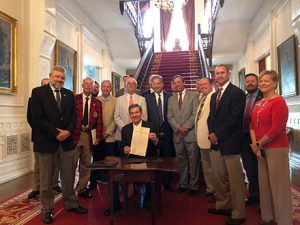 Gov. Rick Cooper presents the NC Golf Day proclamation with golf industry representatives