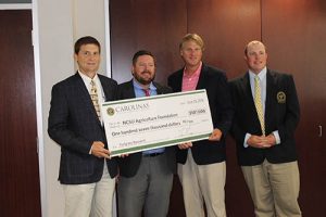 Carolina GCSA representatives present $107,000 check for turfgrass research