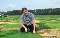 Woman burying oats in thatch. Photos Courtsey of Megan Kennelly and Jack Fry (Figure 3B)