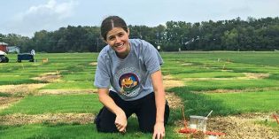 Woman burying oats in thatch. Photos Courtsey of Megan Kennelly and Jack Fry (Figure 3B)
