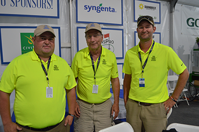 Cochran, Prange, Prange standing in the hospitality tent