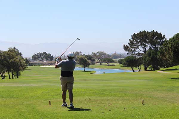 A golfer takes a swing at The Club at Crazy Horse in Salinas, Calif. during Youth on Course's 100 Hole Hike. (Photo: Youth on Course)