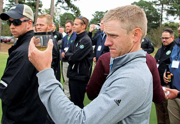 Cory Griess looking at Pythium (Photo: Seth Jones)