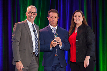 Warren Gorowitz, Ewing vp of Sustainability, Marc Logan, chief agronomist and principal at Greenway Golf, and Christine Kane, CEO of Audubon International at the Water & Sustainability Innovation Award presentation in Phoenix, Arizona. (Photo: Ewing Irrigation & Landscape Supply)