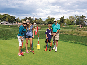 Family on a green at Cattail Creek Mini Course (Photo: Kevin Atkinson)