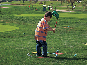 Child teeing off on Cattail Creek Mini Course (Photo: Cattail Creek Mini Course)