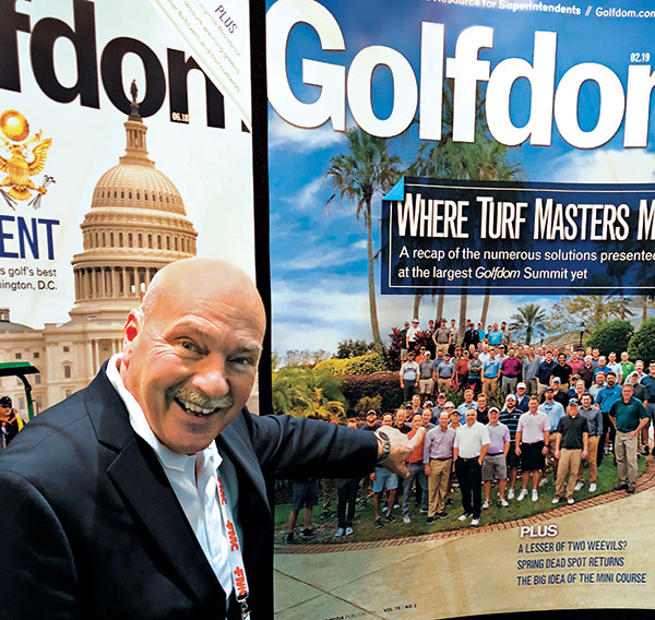 Dan Carrothers at GIS pointing to Golfdom magazine (Photo: Seth Jones)