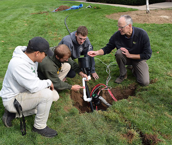 Doug Linde, Ph.D., (right) teaching Delaware Valley University turf management students. (Photo: Delaware Valley University)