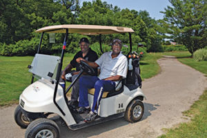 Longtime Rouge Park golfers James “Big House” Williamson (right) and T.J. Hemphill are floored by the course’s new look. (Photo: Abby Hart)