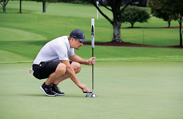 Bryson DeChambeau lines up putts during the practice rounds of the Tour Championship at East Lake. (Photo: Seth Jones)