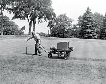 An early topdresser featured a wooden hopper and slats. (Photo: Turfco)