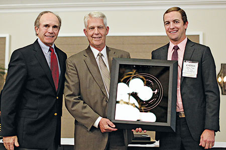 Frank Siple (middle) with his Distinguished Service Award, presented by past U.S. Open champion Jerry Pate, left, and Jamie Pate, of the Jerry Pate Co., right. (Photo: Georgia GCSA)