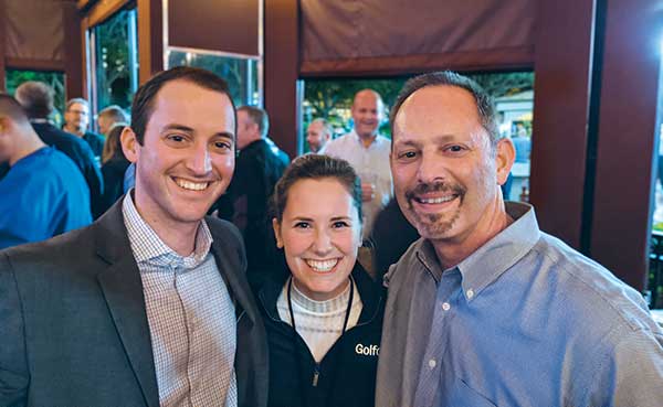 Golfdom Managing Editor Clara McHugh (center) caught up with her pals Charlie Aubry (left), superintendent at Atlanta’s East Lake GC, and Ralph Kepple (right), agronomist at East Lake. (Photo: Golfdom Staff)