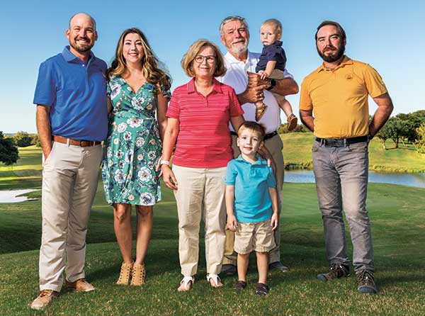 Travis, Carly, Kay, Wyatt, Jim, Shane and Andrew Moore spend many a family meal talking turf. (Photo: Jeff WIlson)