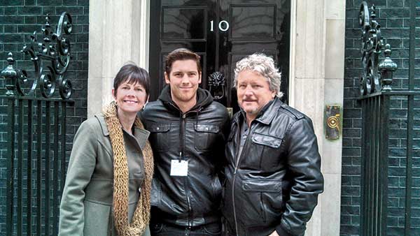 Zack Merrick (center) with his parents Carla and Mark Merrick in front of 10 Downing Street in London. (Photo courtesy of Mark Merrick, CGCS)