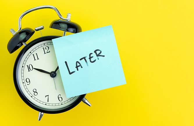 Clock with later sticky note posted to it (Photo: Nuthawut Somsuk / iStock / Getty Images / Getty Images Plus)