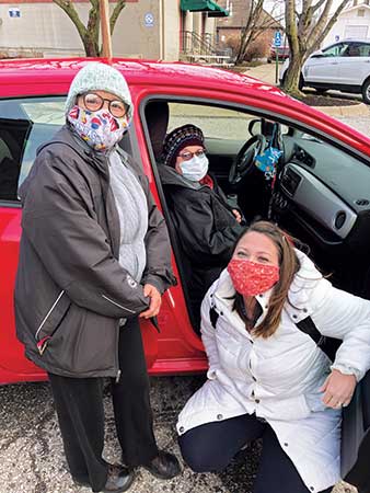 The Jones-Romero family smiles after getting 94-year-old Virginia (center) her vaccine. (Photo courtesy of Golfdom Staff)