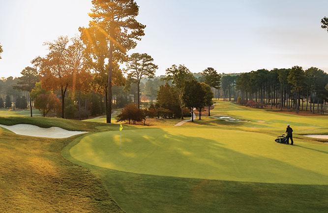 A crew member prepares Atlanta Athletic Club ahead of the Women's PGA Championship. (Photo: John Deere)