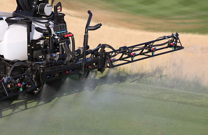 Sprayer putting down fungicide (Photo: ImagineGolf / E+ / Getty Images)