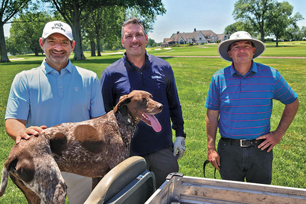 Jason Straka, ASGCA, Craig MacGregor, Golfdom publisher, and Kent Turner, superintendent at Kenwood CC in Cincinnati, with Kent’s dog Crosby. (Photo: Golfdom Staff)