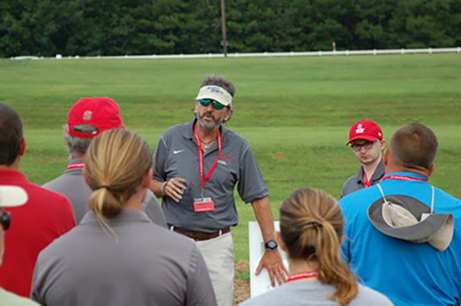 NC State University Professor Fred Yelverton talks to visitors at the school's Turfgrass Field Day (Photo: NC State)