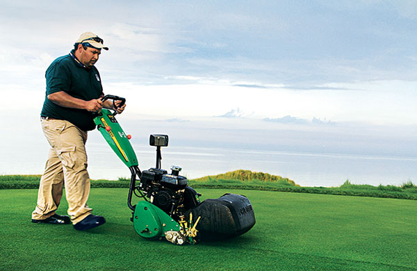 Employee working on golf course (Photo: Golfdom Staff)