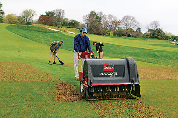 Golf course employee aerating. (Photo: Golfdom Staff)