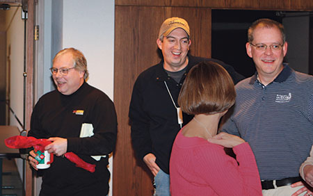 Hiscock, Jones and Golf Course Management magazine’s Scott Hollister (with Teresa Carson in the foreground) when they all worked together for GCSAA in the 2000s. All four keep in touch and remain longtime friends. (Photo by GCSAA)