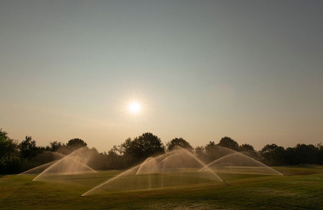 Researchers at UGA testing the benefits of using nanobubble-infused irrigation water on turfgrass. (Photo: Andrew Davis Tucker/UGA)