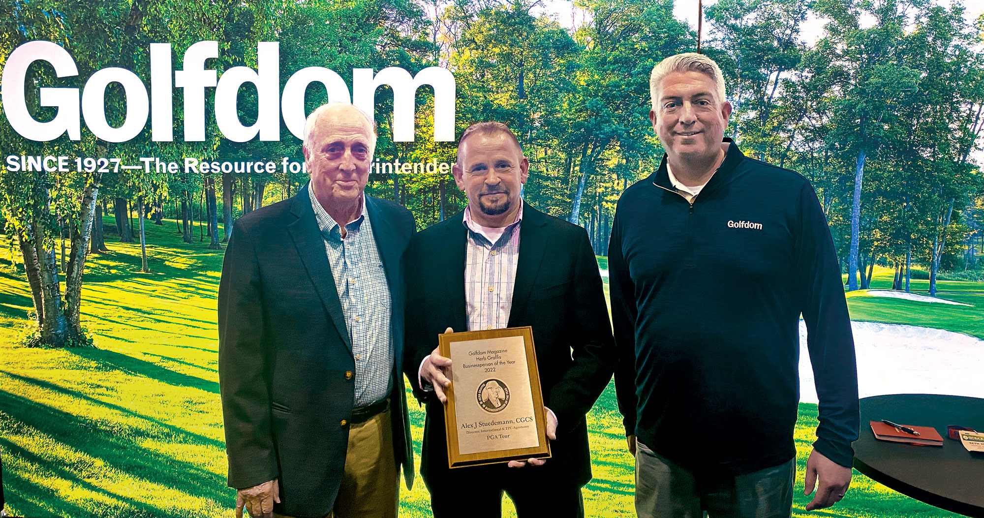 Photo:Rees Jones (left) and Golfdom Editor-in-Chief Seth Jones (right) present Alex J. Stuedemann, CGCS, with the 2022 Herb Graffis Businessperson of the Year Award at the 2023 conference. (Photo: Golfdom staff)