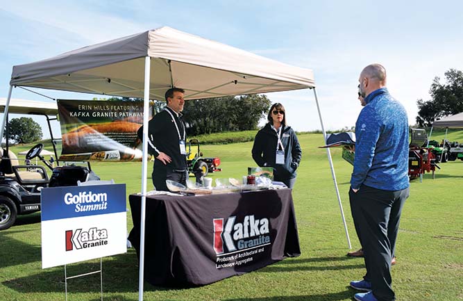 Jason Chilson and Tiffany Koss discuss the strengths of Kafka Granite pathways with Chris Navin, superintendent at the Club at P.B. Dye, Ijamsville, Md.