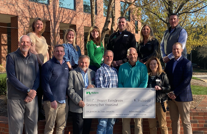 Nufarm’s Blaine Pinkerton (front row, third from right) presents Nufarm’s the check for its sponsorship of the GreenCare for Troops program to the Project EverGreen Board of Directors at the non-profit’s recent board meeting in Raleigh, N.C. (Photo: Project EverGreen)