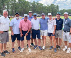 From left to right: Golfdom EIC Seth Jones, Scott Waltz, Aaron Wells and Mark Semm, all reps for BASF, with Steve Harris, Invited Golf and Brian Thompson, BASF and his son, Brendan, with Bill and Connor Roddy, checking out the action at the U.S. Open during Wednesday’s practice round. (Photo: Golfdom staff)