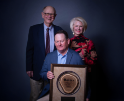 Georgia GCSA Superintendent of the Year, James Drinkard (center), with mentor Buzz Howell (left) and wife, Lynnly (right). (Photo: Georgia GCSA)