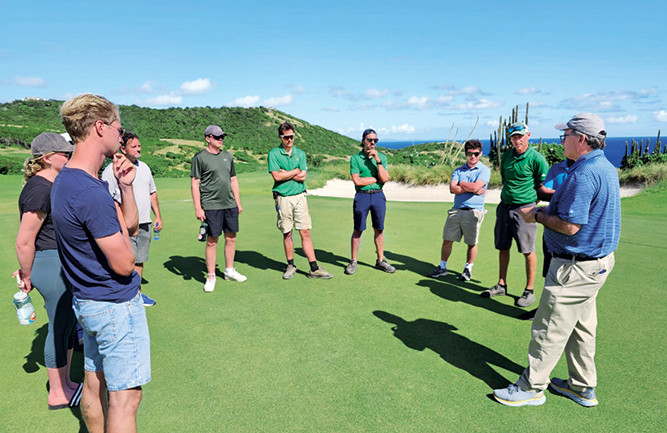 Mike Fidanza, Ph.D., (far right) discussing the challenges and benefits of maintaining seashore paspalum in the Caribbean. (Photo: Damon Di Giorgio)