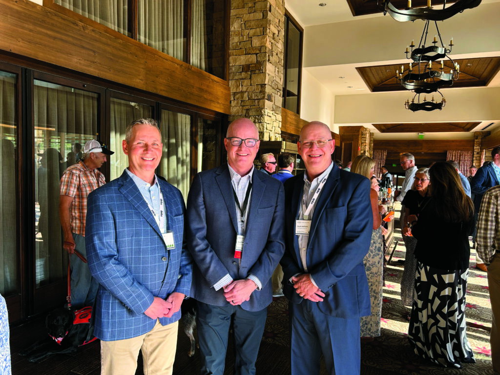 What a way to go: In beautiful Park City, Utah, and just days before his official retirement, Bill Roddy, group publisher, North Coast Media (left) and Scott Hollister, editor, Golfdom (right), toasted David Thorne, OPEI’s board chairman and, at that time, vice president, turf and compact utility business unit for Deere & Co. (Photo: Golfdom staff)